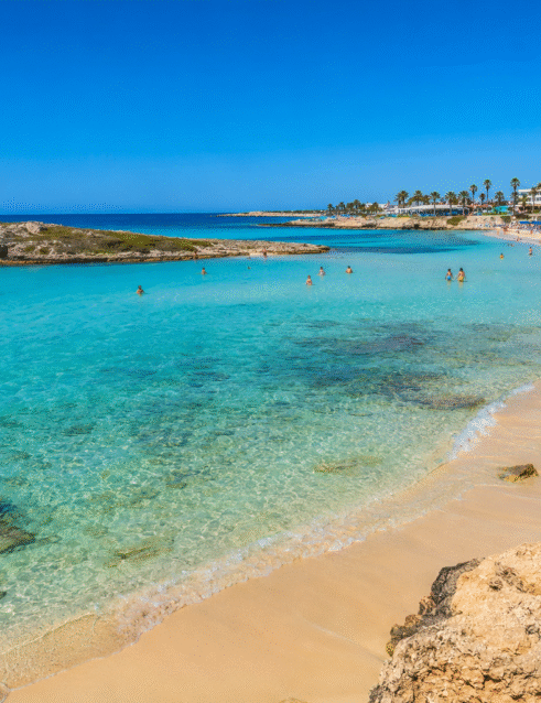 Crystal-clear waters and golden sand at one of the beautiful beaches of Ayia Napa, Cyprus